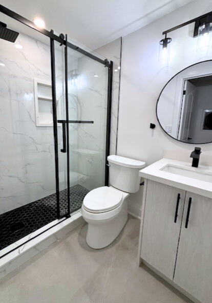 After — full bathroom lighting view