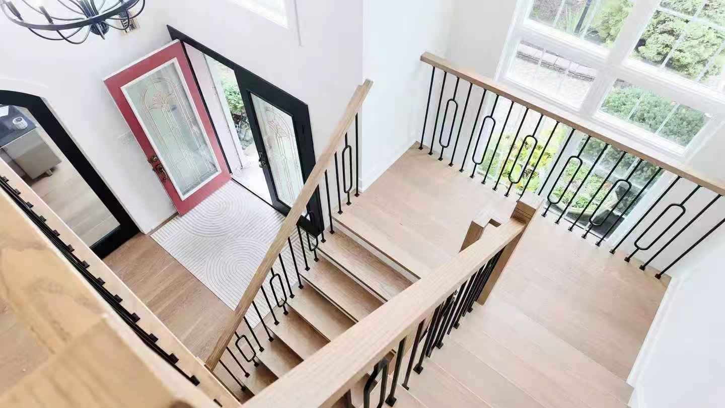 Whole house renovation in Woodbridge with light wood flooring and gold-accent bathroom