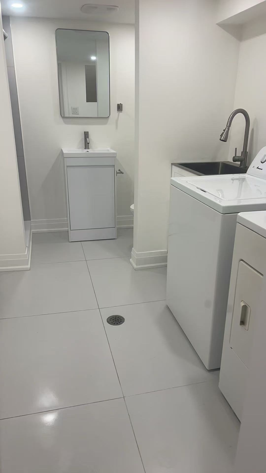 Bathroom with 24-inch vanity and chrome shower fixtures