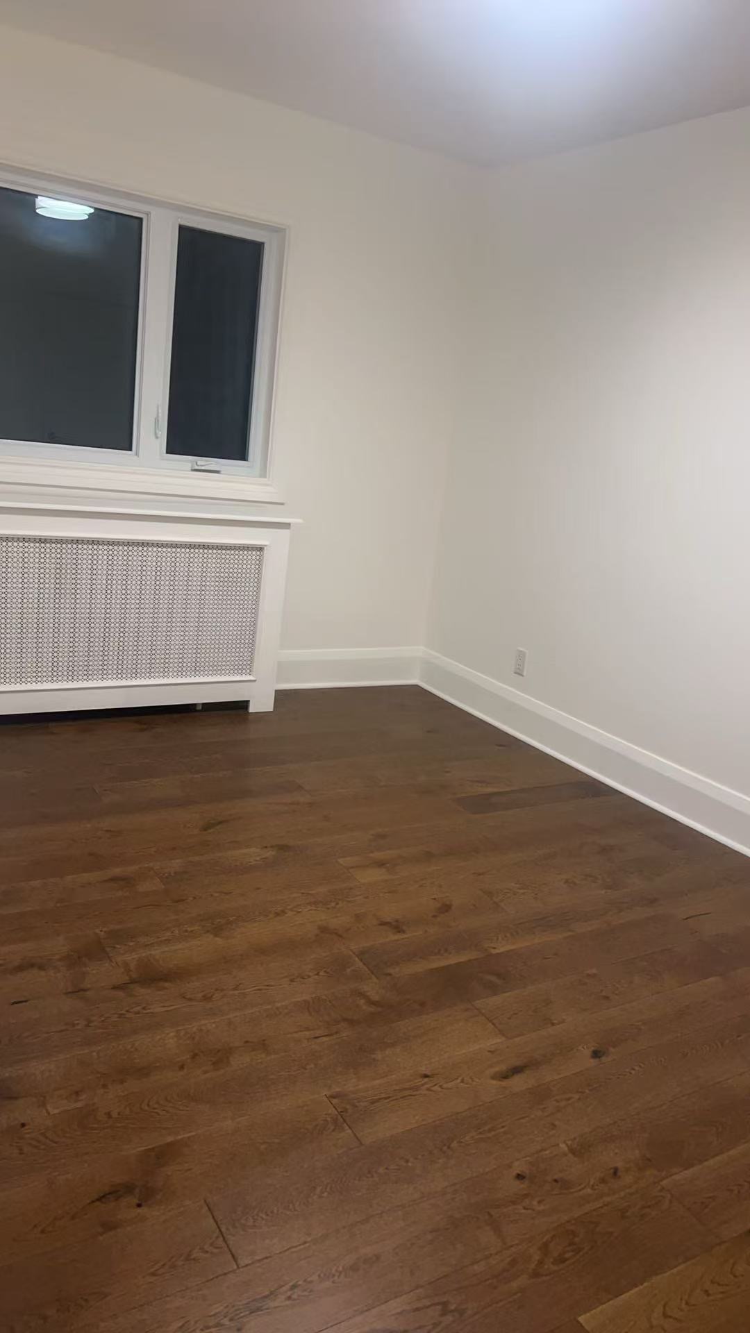 Light kitchen renovation with white cabinets and quartz surface