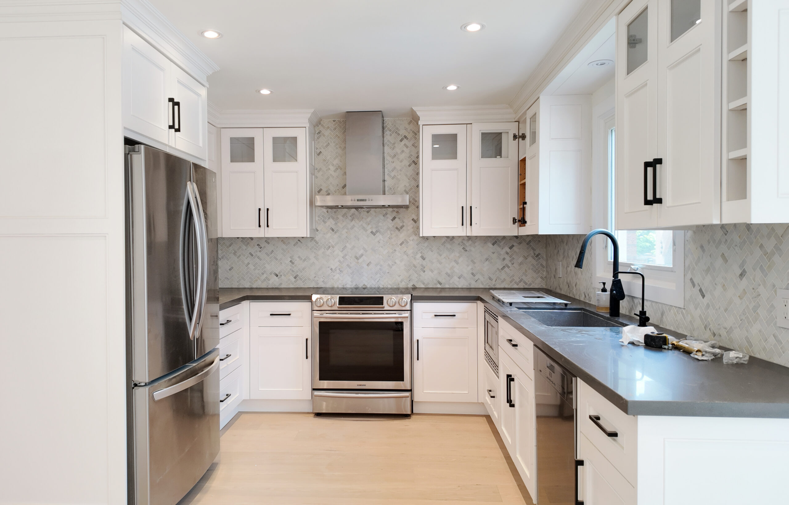 Woodbridge kitchen renovation with dark cabinets and floating white cabinetry