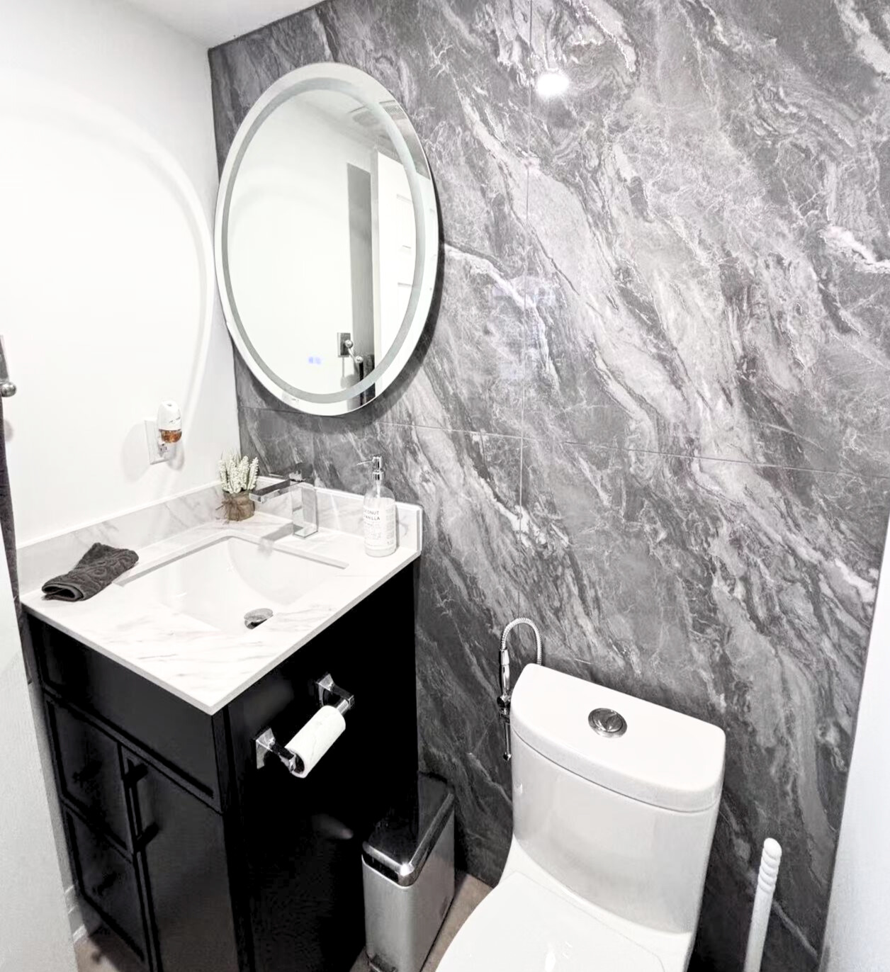 Mississauga 3382 bathroom renovation — wall texture and lighting contrast