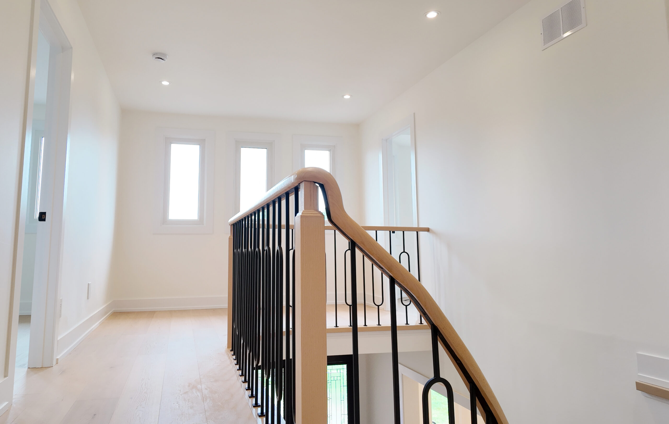 Curved handrail staircase design Woodbridge