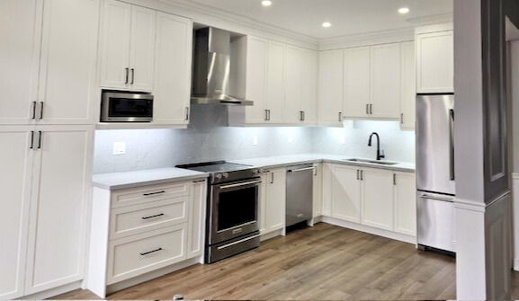 Kitchen renovation Woodbridge — dark floor and white cabinets