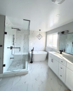 Woodbridge bathroom renovation with dry-wet separation, frameless glass shower, and glossy white floor tiles