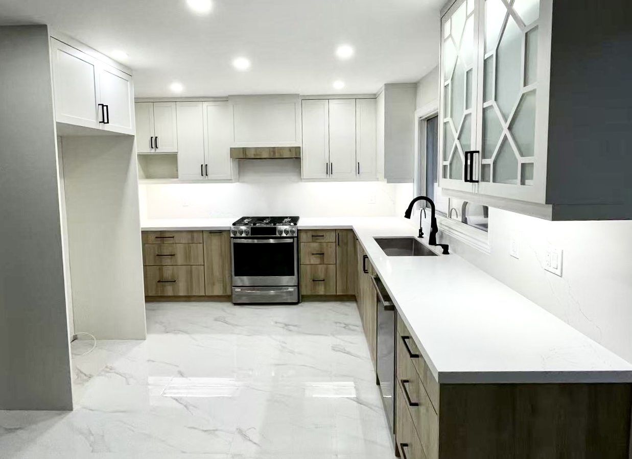 Mississauga all-white kitchen renovation with quartz countertops and LED lighting