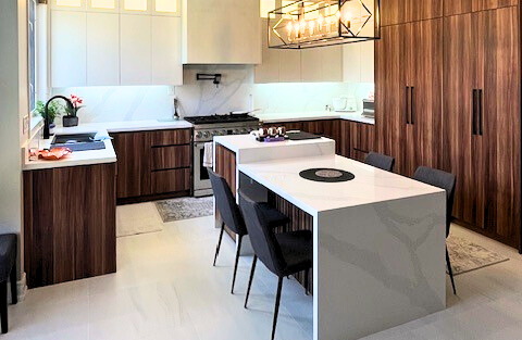 Mississauga open kitchen renovation with white cabinets and quartz island