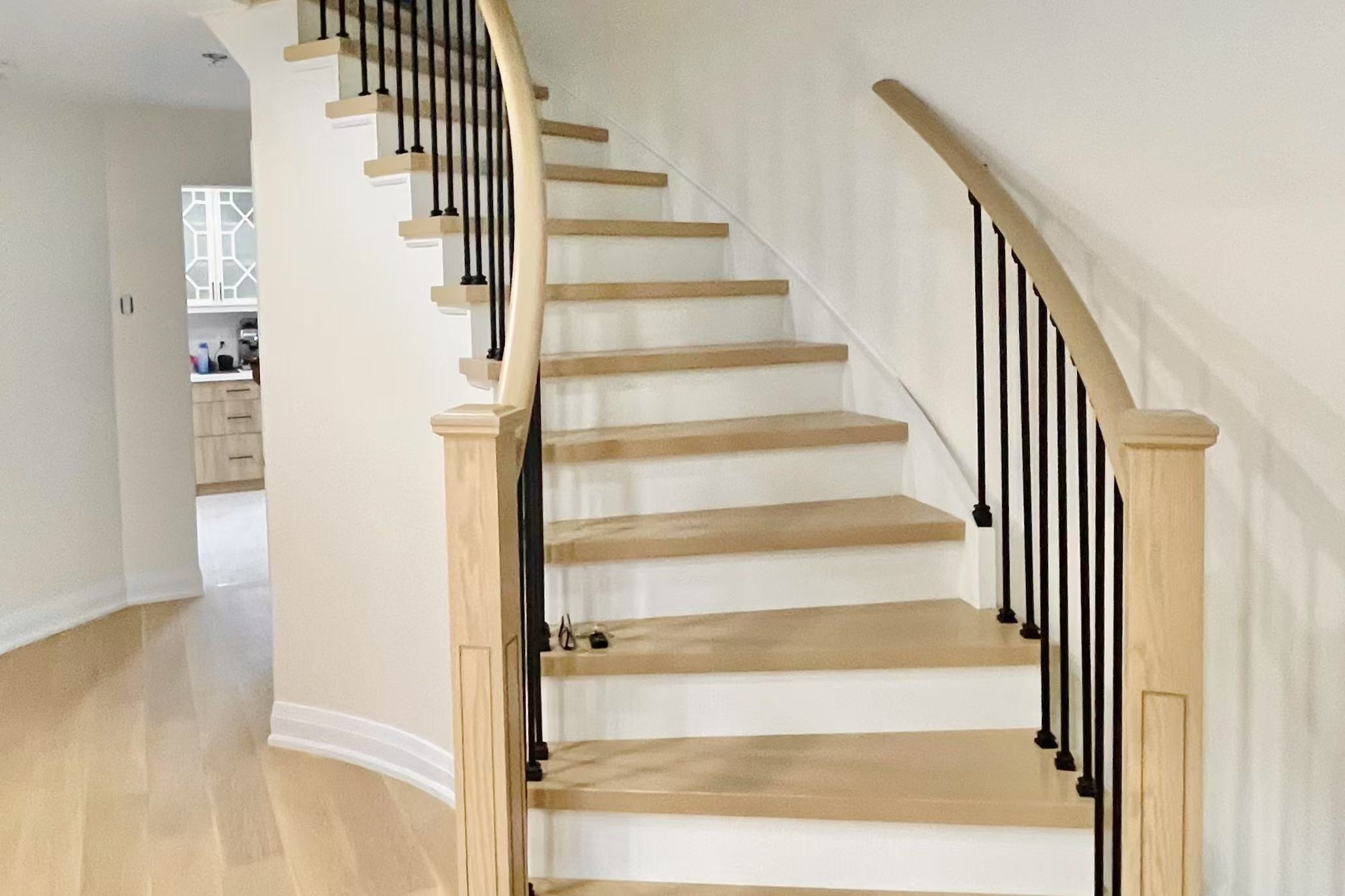 Staircase with continuous flooring design
