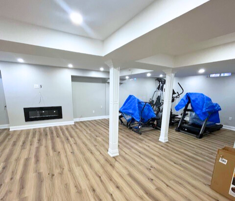 Woodbridge basement renovation with engineered flooring and waterproof insulation