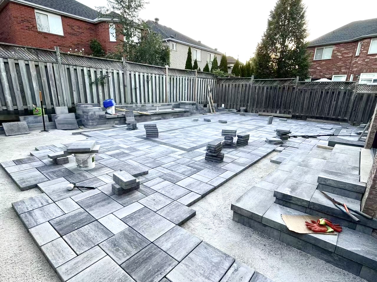 Poolside stone restoration with light-gray porcelain tiles